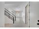 Bright entryway with staircase, light tile flooring, and an open floor plan at 734 Glowing Horizon St, Henderson, NV 89052