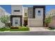 Contemporary two-story home boasts clean lines, neutral colors, and attached two-car garage at 734 Glowing Horizon St, Henderson, NV 89052
