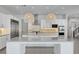 Modern kitchen with stainless steel appliances, large island, and stylish pendant lighting at 734 Glowing Horizon St, Henderson, NV 89052