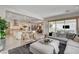 Expansive open-concept living area seamlessly connects the living room, kitchen, and dining spaces at 734 Glowing Horizon St, Henderson, NV 89052
