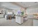 Open-concept living space with tile floors, modern decor, and a view of the kitchen at 734 Glowing Horizon St, Henderson, NV 89052