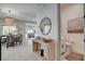 Open-concept living space flows into dining area, powder room, with stylish decor at 734 Glowing Horizon St, Henderson, NV 89052