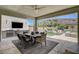 Outdoor living space featuring a covered patio, outdoor kitchen, and pool at 734 Glowing Horizon St, Henderson, NV 89052