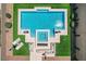 Aerial view of a sparkling pool with spa, lounge seating, and manicured landscaping at 734 Glowing Horizon St, Henderson, NV 89052