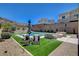 Beautiful backyard pool with lounge chairs, umbrellas, and outdoor seating area at 734 Glowing Horizon St, Henderson, NV 89052