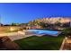 Inviting backyard pool and spa area with fire pit and manicured landscaping at 734 Glowing Horizon St, Henderson, NV 89052