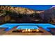 Stunning backyard pool and spa with fire pit and lush landscaping at 734 Glowing Horizon St, Henderson, NV 89052