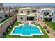 Stunning pool with spa, outdoor seating, and landscaped backyard with city views at 734 Glowing Horizon St, Henderson, NV 89052
