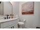 Modern powder room features marble countertop, updated fixtures, and decorative artwork at 734 Glowing Horizon St, Henderson, NV 89052