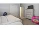 Bedroom with carpet, large dresser and sliding door closet at 7472 Brody Meadows St, North Las Vegas, NV 89084