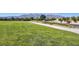 Scenic view of community park with grassy area, walking path, and mountain views at 7472 Brody Meadows St, North Las Vegas, NV 89084