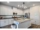 Bright kitchen features granite countertops, stainless steel appliances, and modern lighting at 7472 Brody Meadows St, North Las Vegas, NV 89084