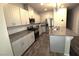 Well-appointed kitchen with stainless steel appliances, granite countertops, and ample cabinetry at 7472 Brody Meadows St, North Las Vegas, NV 89084