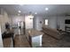 Modern open-concept kitchen with stainless steel appliances and a central island at 7472 Brody Meadows St, North Las Vegas, NV 89084