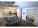 Open floor plan combining the living room and kitchen with modern decor at 7472 Brody Meadows St, North Las Vegas, NV 89084