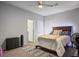 Comfortable bedroom with carpet, a bed and two windows at 7472 Brody Meadows St, North Las Vegas, NV 89084