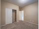 Cozy bedroom featuring carpet, a closet, and neutral paint at 7605 Lake Fork Peak St, Las Vegas, NV 89166