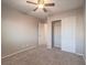 Bedroom with fan and closet featuring carpet at 7605 Lake Fork Peak St, Las Vegas, NV 89166
