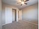 Bedroom with fan and closet featuring carpet at 7605 Lake Fork Peak St, Las Vegas, NV 89166