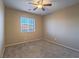 Bedroom showcasing a ceiling fan and a window for natural light at 7605 Lake Fork Peak St, Las Vegas, NV 89166