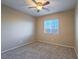 Bedroom showcasing a ceiling fan and a window for natural light at 7605 Lake Fork Peak St, Las Vegas, NV 89166