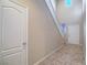 Light and bright foyer with high ceilings, tile floors, staircase, and access to other rooms at 7605 Lake Fork Peak St, Las Vegas, NV 89166