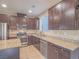 The kitchen includes stainless steel appliances, granite countertops, and plentiful cabinet space at 7605 Lake Fork Peak St, Las Vegas, NV 89166