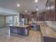 Well-equipped kitchen featuring granite countertops, stainless steel appliances, and large island at 7605 Lake Fork Peak St, Las Vegas, NV 89166