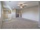Spacious loft with carpet, white railings, and neutral walls at 7605 Lake Fork Peak St, Las Vegas, NV 89166