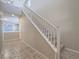 Staircase with white banister leads to the second floor with views into another living space at 7605 Lake Fork Peak St, Las Vegas, NV 89166