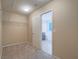 Walk-in closet featuring carpet, wire shelving and access to bathroom at 7605 Lake Fork Peak St, Las Vegas, NV 89166