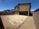 Exterior view of the backyard showcasing the home's architecture and private outdoor space at 7636 Bandon Cliffs St, North Las Vegas, NV 89084