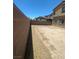 View of backyard with a brick perimeter wall at 7636 Bandon Cliffs St, North Las Vegas, NV 89084