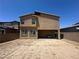 Exterior view of the backyard showcasing the home's architecture and private outdoor space at 7636 Bandon Cliffs St, North Las Vegas, NV 89084