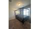 Contemporary bedroom featuring a four-poster bed, plush carpet, and ample natural light at 7636 Bandon Cliffs St, North Las Vegas, NV 89084
