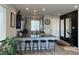 Open kitchen featuring granite countertops, breakfast bar and stainless steel appliances at 7636 Bandon Cliffs St, North Las Vegas, NV 89084