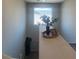 Bright landing area featuring a window with mountain views, neutral decor, and stylish accents at 7636 Bandon Cliffs St, North Las Vegas, NV 89084
