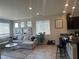 Spacious living room with recessed lighting, comfortable seating and granite kitchen counter at 7636 Bandon Cliffs St, North Las Vegas, NV 89084