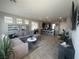 Inviting living area with tile floors, stylish decor, and seamless flow to kitchen with bar seating at 7636 Bandon Cliffs St, North Las Vegas, NV 89084