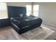 Serene main bedroom showcasing a high-end bed, elegant decor, and soft natural light at 7636 Bandon Cliffs St, North Las Vegas, NV 89084
