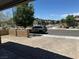 This is a street view of the property with sidewalks and nicely landscaped areas at 7636 Bandon Cliffs St, North Las Vegas, NV 89084