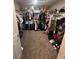 Walk-in closet with built-in shelving and ample storage space for clothes and accessories at 7636 Bandon Cliffs St, North Las Vegas, NV 89084