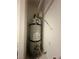 A large water heater is placed in a small closet at 7636 Bandon Cliffs St, North Las Vegas, NV 89084