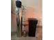 Water softener system with silver metal tank and black control unit at 7636 Bandon Cliffs St, North Las Vegas, NV 89084