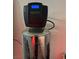 Close-up of AquaKleen water softener system with digital display at 7636 Bandon Cliffs St, North Las Vegas, NV 89084
