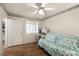 Bedroom offers wood floors, futon, desk, chair, and closet at 7950 W Flamingo Rd # 1024, Las Vegas, NV 89147