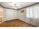 Light-filled bedroom with wood floors, closet, and decorative trim at 7950 W Flamingo Rd # 1024, Las Vegas, NV 89147