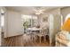 Bright dining room with hardwood floors, modern fan, and decorative screen at 7950 W Flamingo Rd # 1024, Las Vegas, NV 89147