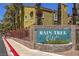 Inviting Rain Tree West condo complex with lush landscaping and warm exterior paint colors at 7950 W Flamingo Rd # 1024, Las Vegas, NV 89147