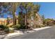 Exterior view of a two-story condo featuring lush landscaping at 7950 W Flamingo Rd # 1024, Las Vegas, NV 89147